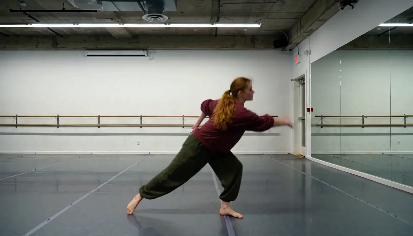Dancer moving across a mirrored rehearsal studio